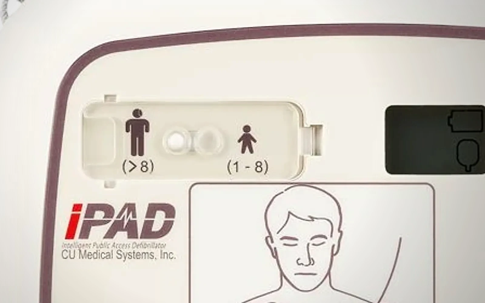 Panel defibrylatora CU Medical iPAD SP1: przesuwany przełącznik z sylwetką dorosłego po lewej i dziecka po prawej stronie